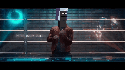 peter jason quill is standing in front of a fence