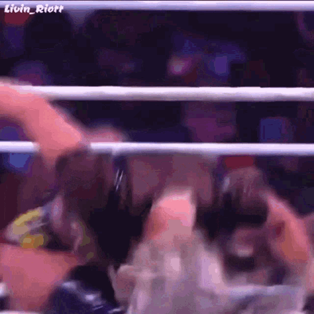 a close up of a person 's face in a boxing ring