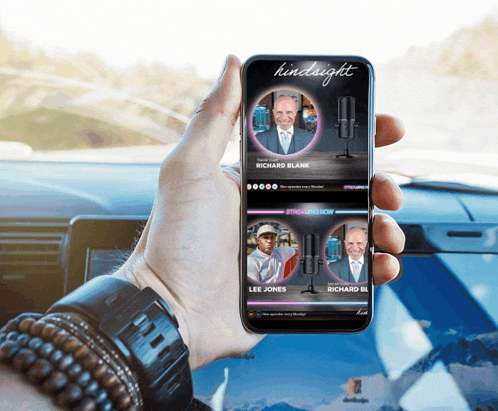 a person is holding a phone that says hindsight