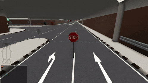 a stop sign is in the middle of an empty tunnel
