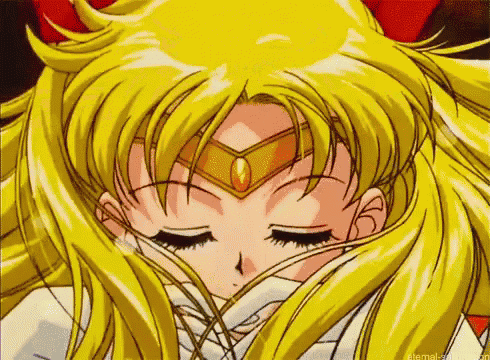 a close up of a girl 's face with her eyes closed .
