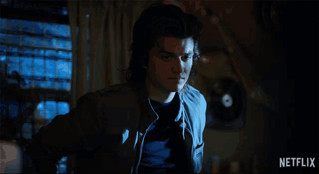 a netflix advertisement shows a man in a jacket asking what do you mean