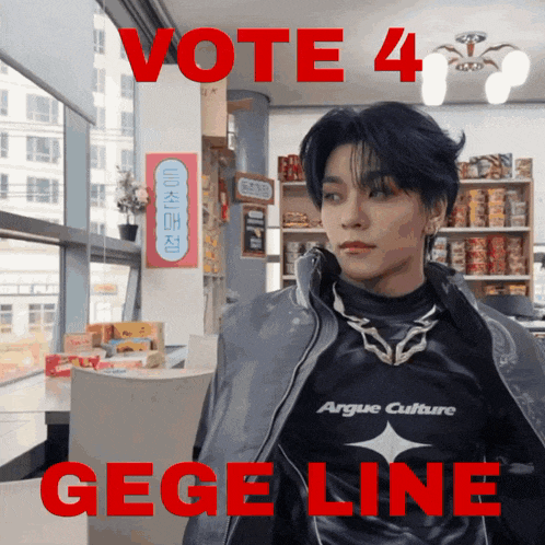 a man wearing a jacket that says argue culture stands in front of a sign that says vote 4