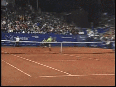 a tennis player is swinging a tennis racquet on a court with a movistar advertisement behind him