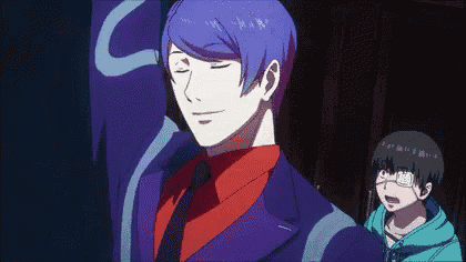 a man with purple hair and a red shirt is smiling with his eyes closed