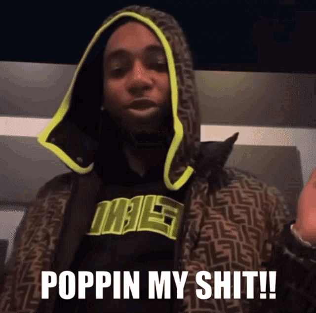 a man in a hooded jacket says poppin my shit !