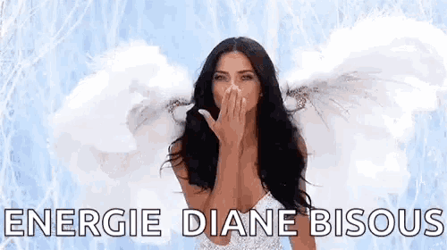 a woman with angel wings is blowing a kiss while covering her face .