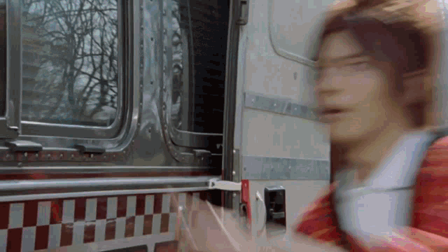 a blurry picture of a person getting out of a vehicle