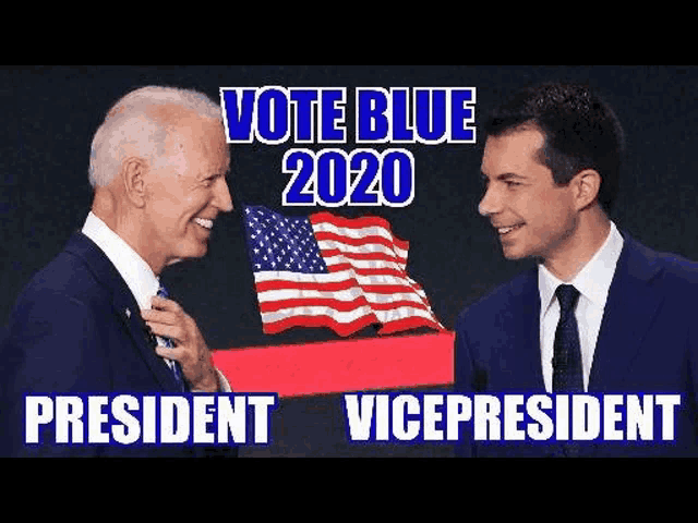 a man in a suit and tie is standing next to another man in a suit and tie with an american flag in the background .