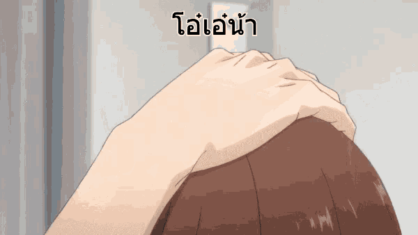a close up of a person 's head with a hand on it in a foreign language .