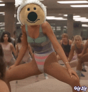 a woman in a leotard with a teddy bear on her head