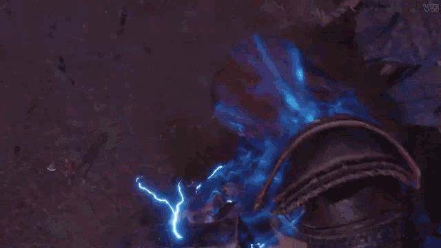 a man is being hit by a lightning bolt while holding a hammer .