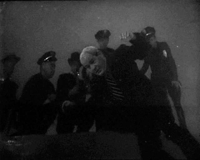 a black and white photo of a person with a light shining on them