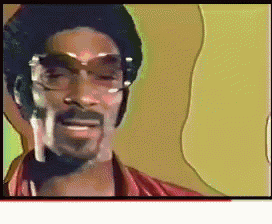 a man with glasses and a mustache is smiling