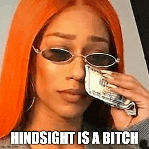 a woman wearing sunglasses is holding a piece of money in her hand and crying .