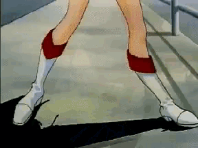 a close up of a person 's legs wearing white boots and red socks