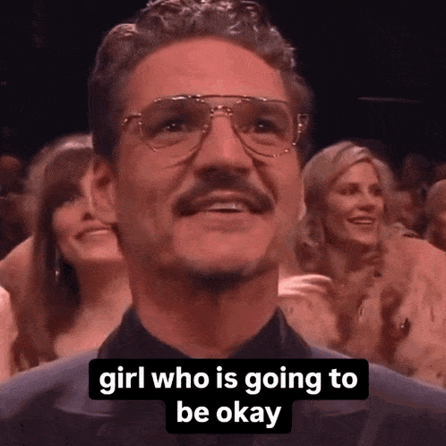 a man with glasses and a mustache says " girl who is going to be okay " in a crowd of people