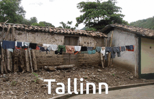 clothes hanging on a line outside a building that says tallinn on the bottom