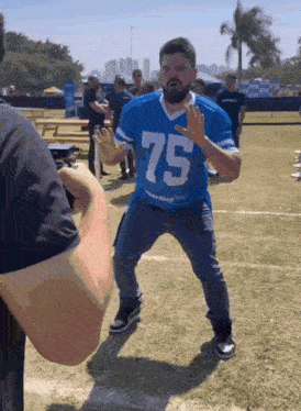 a man with the number 75 on his jersey