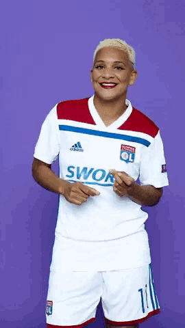 a woman wearing a white adidas swor jersey