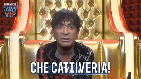 a man sitting in a chair with the words che cattiveria written on the screen