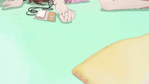 a girl in a pink top and blue shorts laying on the floor