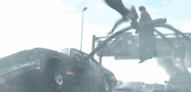 a spider-man and octopus are fighting over a car in a city