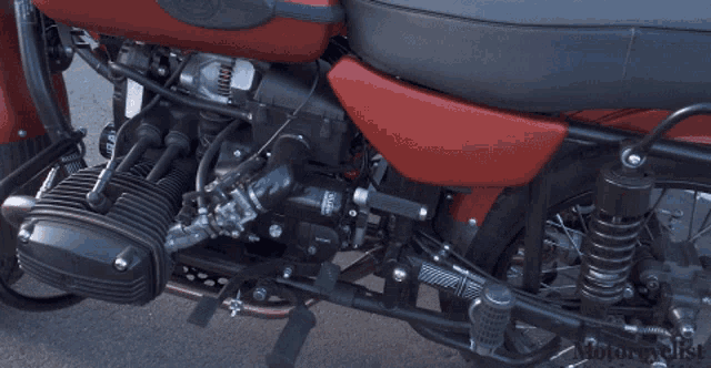 a close up of a motorcycle engine with the word motorcycle on the bottom left