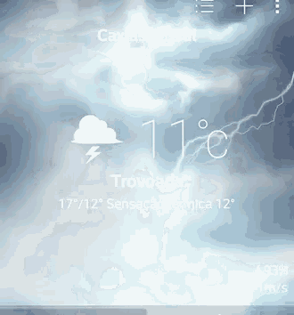 a phone screen shows a cloud and lightning with the temperature at 11 degrees celsius