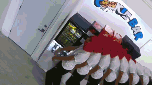 a group of people are standing in front of a wall that says ' a & r '