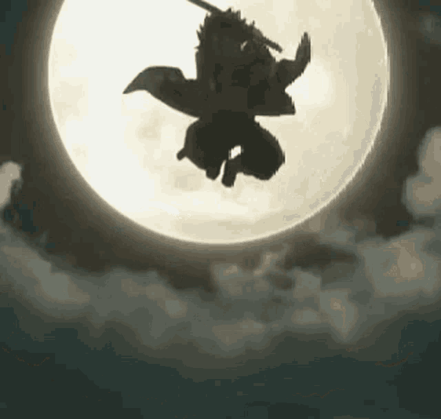 a silhouette of a person flying through the air with a sword in front of a full moon .