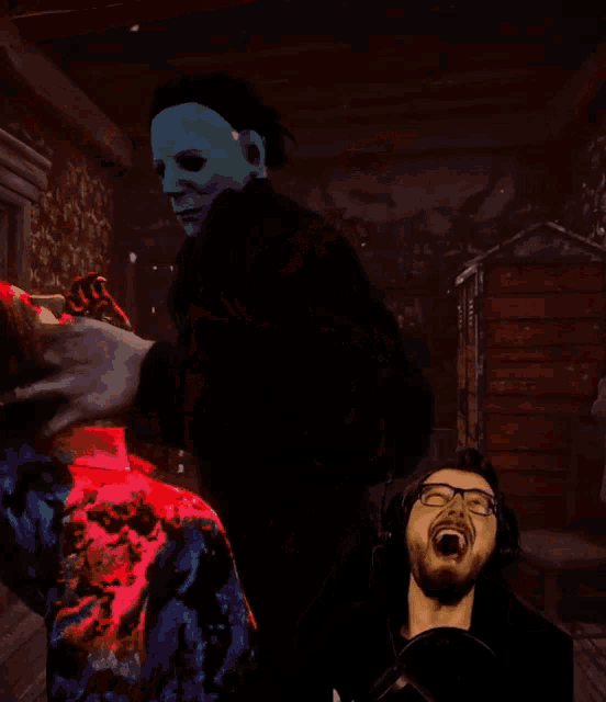 a man wearing glasses is laughing while playing a game