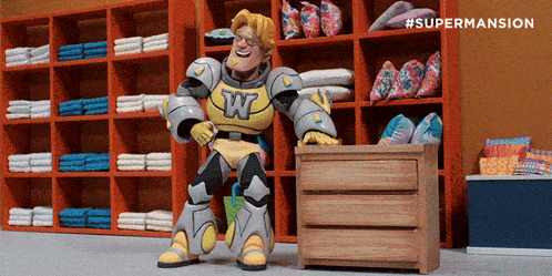 a cartoon character with the letter w on his chest sits in a room