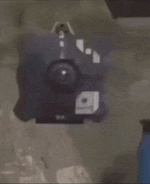 a blurred image of a black object with the number 9 on it .