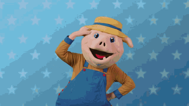 a pig mascot wearing overalls and a hat
