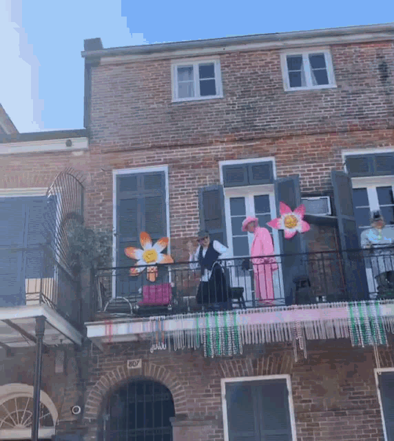 a balcony in front of a brick building with the number 400