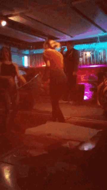 a blurry picture of a person dancing in a dark room