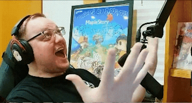 a man wearing headphones is playing a game called maplestory