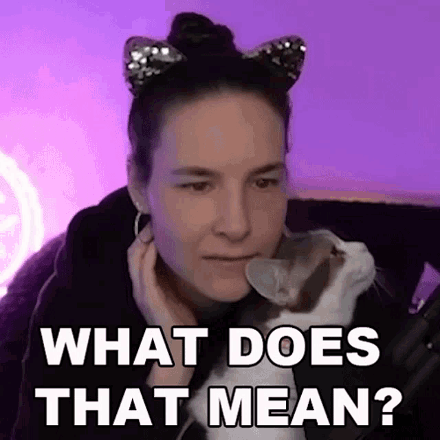 a woman wearing cat ears is holding a cat and asking what does that mean ?