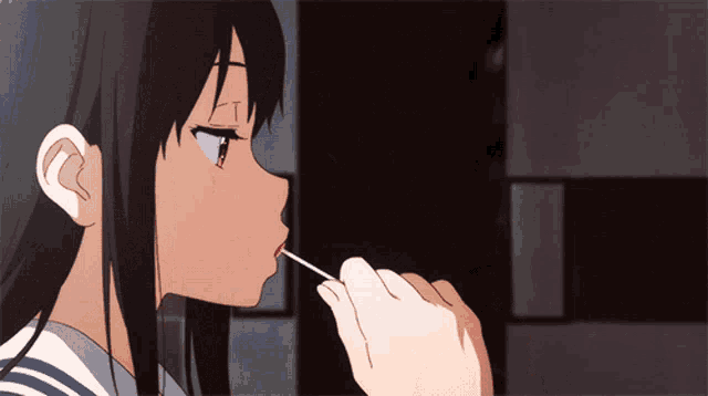 a girl in a school uniform is applying lipstick