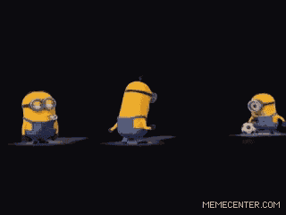 a group of minions are standing next to a soccer ball