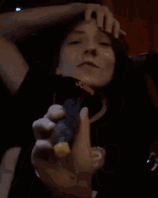 a woman is holding a microphone that says joan on it