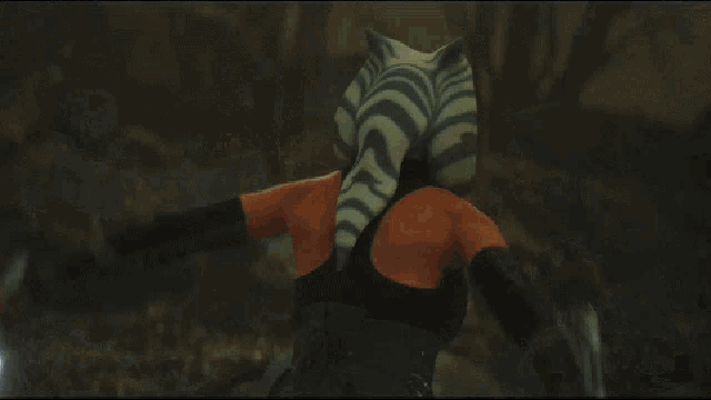 a woman with a tiger head is holding a lightsaber
