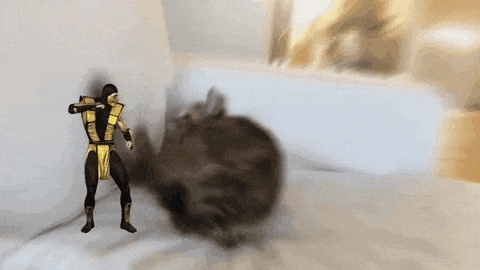 a man in a yellow and black costume is standing in front of a large black object