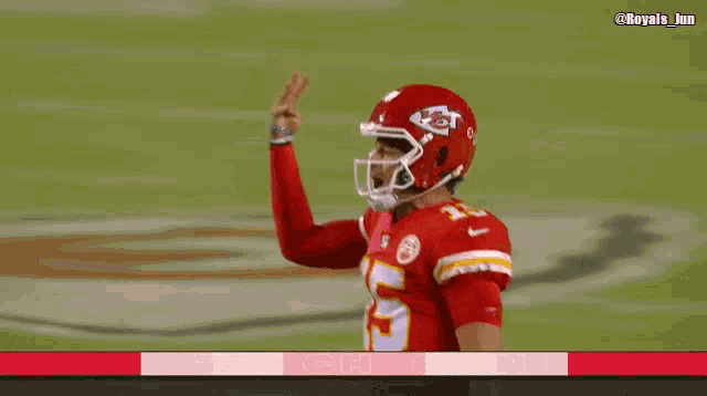 a football player wearing a red jersey with the number 5 on it