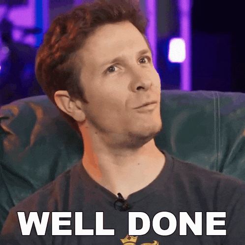 a man is sitting in a chair with the words well done written on the screen