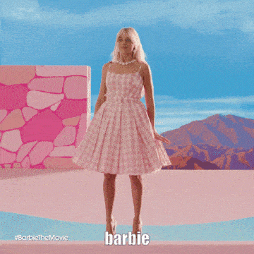 a barbie doll in a pink dress is dancing