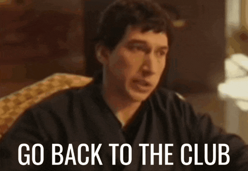 a man is sitting in a chair with the words go back to the club below him .