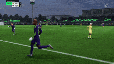 a man in a purple jersey with the number 10 on it stands on a soccer field