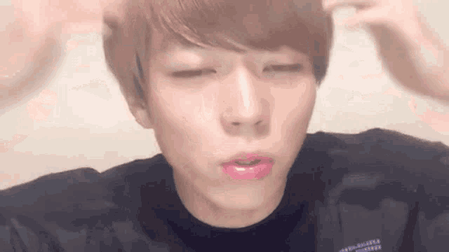 a close up of a person 's face with pink lipstick on